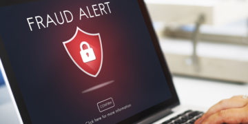Image of fraud alert page on a laptop
