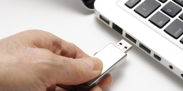 image of a usb stick going into a laptop