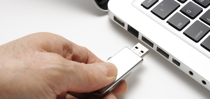 image of a usb stick going into a laptop