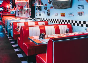red padded sofa and tables inside building