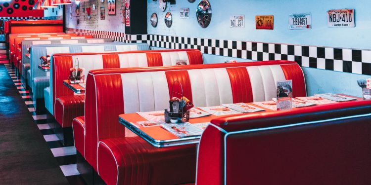 red padded sofa and tables inside building