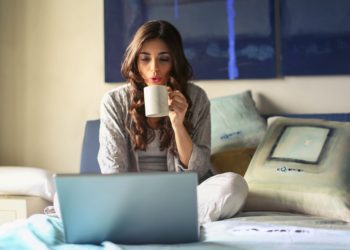 Woman in grey working from home