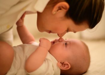 Mother and baby touching noses