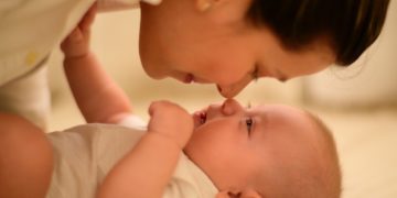 Mother and baby touching noses