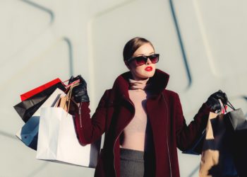 Chic woman shopping with multiple bags