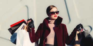 Chic woman shopping with multiple bags
