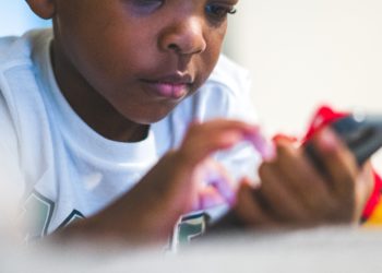 Child playing on a mobile phone