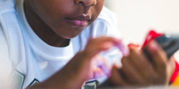 Child playing on a mobile phone
