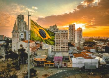 Brazillian skyline with flag in the forefront