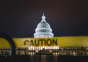 The capitol with caution tape around it