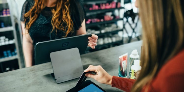 Customer paying with card reader