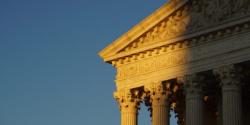 The US supreme court roof top at dawn