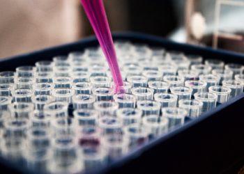 Pipette dropping liquid into test tubes