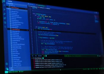 A dark computer screen with code