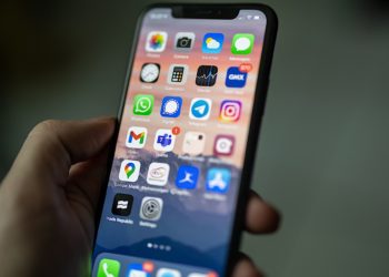 Phone screen showing a variety of apps, that are slightly blurred. Signal is sharp and stands out.