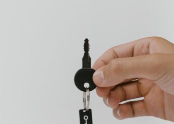 The purpose of this image is to portray security through a key attached to what looks like a memory card.