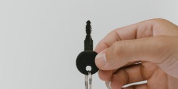 The purpose of this image is to portray security through a key attached to what looks like a memory card.