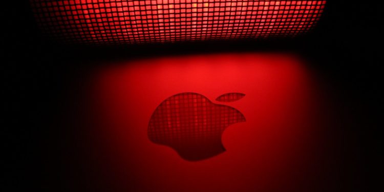Apple logo shadowed in a red light