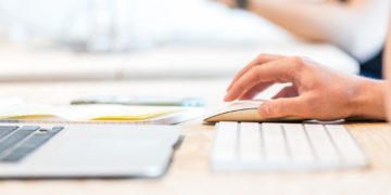Someone using a macbook