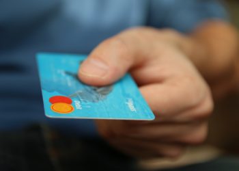 Credit card being handed over