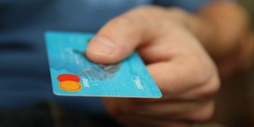 Credit card being handed over
