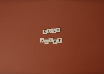 scrabble letters spelling out "Scam Alert"