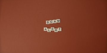 scrabble letters spelling out "Scam Alert"