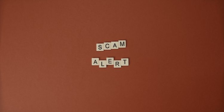 scrabble letters spelling out "Scam Alert"