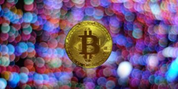 Bitcoin surrounded by colourful dots of light. The colour scheme revolves around purple tones