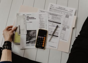 Someone filling out tax forms