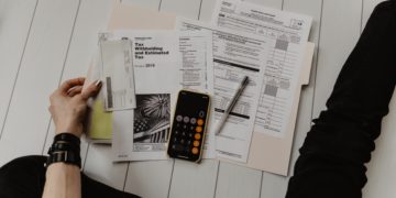 Someone filling out tax forms