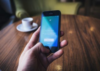 Person using twitter on their phone