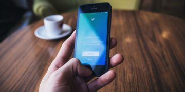 Person using twitter on their phone
