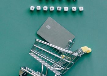 Miniature shopping cart with words 'online shopping'