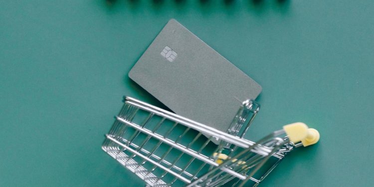 Miniature shopping cart with words 'online shopping'