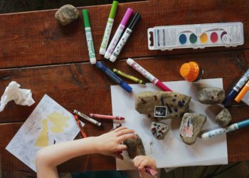 Child playing with crayons