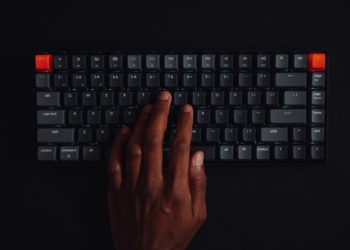 Person typing on a key board