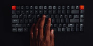 Person typing on a key board