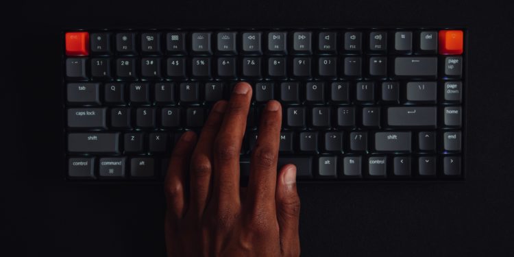 Person typing on a key board