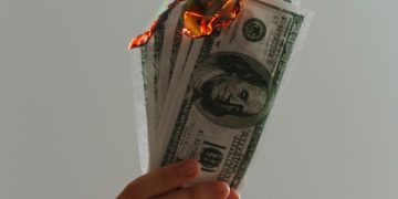 Burning dollar notes