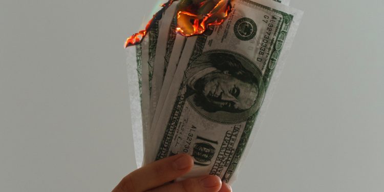 Burning dollar notes