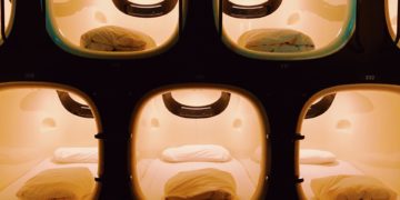 Capsule hotel rooms lit up