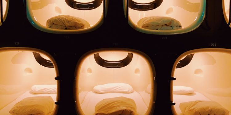 Capsule hotel rooms lit up