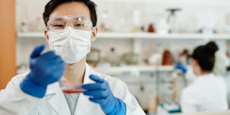 Chemist conducting experiment