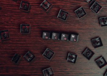 keys reading "scam"