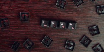 keys reading "scam"