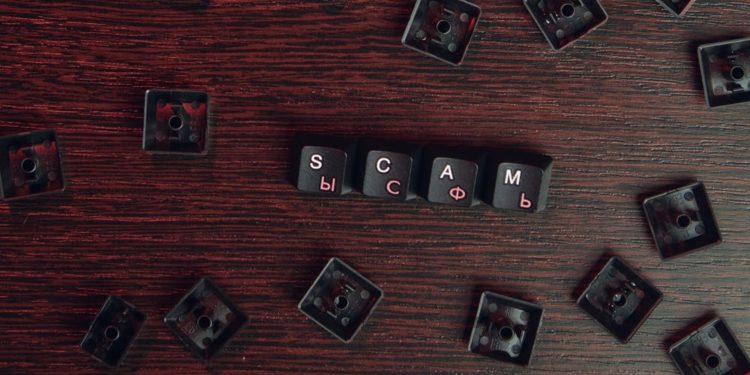 keys reading "scam"