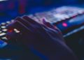 hand typing on keyboard