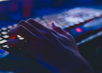 hand typing on keyboard