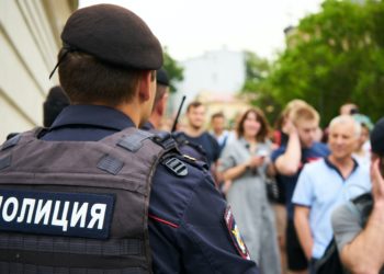 police standing in front of crowd